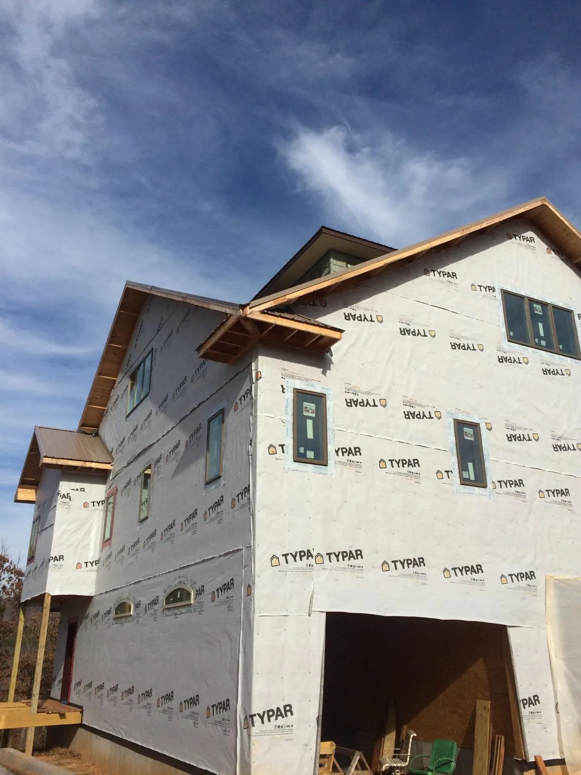 Stick built house wrapped in Typar with new roof framing and dormers in East Setauket
